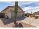 Exterior of a desert home with a two car garage, low-maintenance landscaping, and ample parking at 289 W Ironhorse Ln, San Tan Valley, AZ 85143