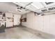 Organized garage with ample storage cabinets and a clean epoxy-coated floor at 289 W Ironhorse Ln, San Tan Valley, AZ 85143
