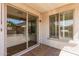 Outdoor patio with a sliding glass door and view to lush yard at 289 W Ironhorse Ln, San Tan Valley, AZ 85143
