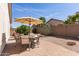 Outdoor patio with seating and desert landscaping at 289 W Ironhorse Ln, San Tan Valley, AZ 85143