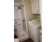 Bright bathroom with a walk-in shower and a white washing machine and dryer set at 303 S Recker Rd # 218, Mesa, AZ 85206