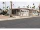 Well-maintained home exterior showcasing its charming curb appeal with mature landscaping at 303 S Recker Rd # 218, Mesa, AZ 85206
