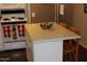 Kitchen island offering additional countertop space and seating for casual dining at 303 S Recker Rd # 218, Mesa, AZ 85206