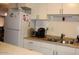 Bright kitchen featuring ample counter space, white appliances, and storage for all your needs at 303 S Recker Rd # 218, Mesa, AZ 85206
