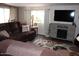 Warm and inviting living area with a plush sofa, decorative rug, and entertainment center for comfortable living at 303 S Recker Rd # 218, Mesa, AZ 85206
