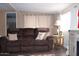 Comfortable living area featuring a plush sofa and stylish decor for relaxing or entertaining at 303 S Recker Rd # 218, Mesa, AZ 85206