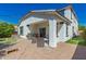 Backyard patio with a built-in grill and artificial grass at 3129 E Franklin Ave, Gilbert, AZ 85295