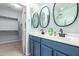 Bathroom boasts dual sinks with modern fixtures and walk in closet at 3129 E Franklin Ave, Gilbert, AZ 85295