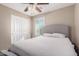 Bedroom featuring a ceiling fan, carpet and closet at 3129 E Franklin Ave, Gilbert, AZ 85295