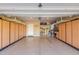 Spacious garage with epoxy flooring, ample storage cabinets, and overhead racks at 3129 E Franklin Ave, Gilbert, AZ 85295