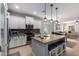 Spacious kitchen featuring granite countertops, pendant lighting, and stainless steel appliances at 3129 E Franklin Ave, Gilbert, AZ 85295