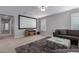 Large living room with a big screen projector at 3129 E Franklin Ave, Gilbert, AZ 85295