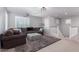 Cozy living room with plush seating, lots of light and neutral color palette at 3129 E Franklin Ave, Gilbert, AZ 85295