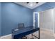 Modern home office with sleek desk, comfortable chair, and open doorway at 3129 E Franklin Ave, Gilbert, AZ 85295