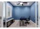 Dedicated home office space with a modern desk, shuttered windows and a comfortable chair at 3129 E Franklin Ave, Gilbert, AZ 85295