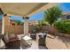 Charming covered patio with stylish seating, perfect for outdoor relaxation and entertaining at 3129 E Franklin Ave, Gilbert, AZ 85295