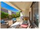 Relaxing covered patio with grill, sink and seating, ideal for al fresco dining and entertainment at 3129 E Franklin Ave, Gilbert, AZ 85295