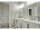 Bright bathroom featuring dual vanities and a separate shower and toilet at 3564 N Tuscany --, Mesa, AZ 85207