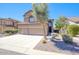 Charming stucco home with a three-car garage, desert landscaping, and a unique architectural design at 3564 N Tuscany --, Mesa, AZ 85207