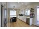 Bright kitchen with white cabinets, a center island and stainless steel appliances at 3564 N Tuscany --, Mesa, AZ 85207