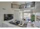 Lofted living room showcasing modern railing, backyard views, and open floor plan at 3564 N Tuscany --, Mesa, AZ 85207