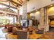 Grand lobby boasts soaring ceilings, stone fireplace, plush seating, and exquisite decor, offering a luxurious space at 3564 N Tuscany --, Mesa, AZ 85207