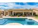 Stunning backyard features a sparkling pool, covered patio, and lush landscaping at 3871 S Marion Way, Chandler, AZ 85286