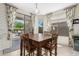 Bright dining area with a wooden table, patio access and beverage cooler at 3871 S Marion Way, Chandler, AZ 85286