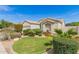 Inviting home featuring desert landscaping and a well-manicured lawn at 3871 S Marion Way, Chandler, AZ 85286
