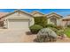 Charming single-story home with a two-car garage, desert landscaping, and a neutral color palette at 3871 S Marion Way, Chandler, AZ 85286