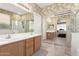 Bright main bathroom with dual sinks, large mirrors and a shower at 3871 S Marion Way, Chandler, AZ 85286