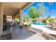 Expansive covered patio overlooking the pool and landscaped backyard at 3871 S Marion Way, Chandler, AZ 85286