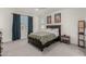 A comfortable main bedroom featuring neutral colors, carpet, and natural lighting at 399 N 157Th Ln, Goodyear, AZ 85338