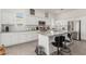 Bright kitchen featuring granite countertops, stainless steel appliances, and white cabinets at 399 N 157Th Ln, Goodyear, AZ 85338