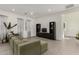 Spacious living room with hardwood floors, modern furniture, a ceiling fan, and plenty of natural light at 399 N 157Th Ln, Goodyear, AZ 85338