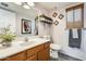 Well-lit bathroom features stylish decor, a vanity, and tiled floors at 4050 W Camino Del Rio --, Glendale, AZ 85310