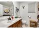 Bright bathroom with a mirror, a shower with a curtain, and bull skull art at 4050 W Camino Del Rio --, Glendale, AZ 85310