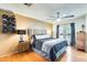 Cozy bedroom with hardwood floors, ceiling fan, and French doors to the outside at 4050 W Camino Del Rio --, Glendale, AZ 85310