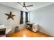 Bright bedroom with wood floors, ceiling fan and work desk, perfect for any lifestyle at 4050 W Camino Del Rio --, Glendale, AZ 85310