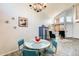 Charming dining area with unique table set, statement chandelier, and modern decor, seamlessly blending style and comfort at 4050 W Camino Del Rio --, Glendale, AZ 85310