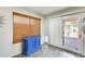 Dining area with a bright blue cabinet and sliding door leading to the patio at 4050 W Camino Del Rio --, Glendale, AZ 85310