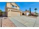 Well-maintained home featuring a two-car garage, desert landscaping, and a welcoming exterior at 4050 W Camino Del Rio --, Glendale, AZ 85310