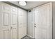 Hallway featuring multiple closets and a white door, perfect for storage at 4050 W Camino Del Rio --, Glendale, AZ 85310
