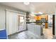 Spacious eat-in kitchen features a sliding glass door and granite countertops at 4050 W Camino Del Rio --, Glendale, AZ 85310