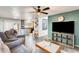 Open-concept living room with a kitchen view, modern decor, and tile flooring at 4050 W Camino Del Rio --, Glendale, AZ 85310