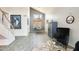 Spacious living room with high ceilings, tile floors, modern decor, and natural light creating a cozy atmosphere at 4050 W Camino Del Rio --, Glendale, AZ 85310
