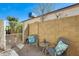 Outdoor patio with seating area, brick walls, and gated entrance, offering a private and cozy relaxation space at 4050 W Camino Del Rio --, Glendale, AZ 85310