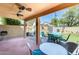 Inviting covered patio with ceiling fans and outdoor seating, perfect for relaxing and entertaining at 4050 W Camino Del Rio --, Glendale, AZ 85310