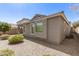 An exterior view with gravel provides low-maintenance landscaping and enhances curb appeal at 4176 E Bonanza Rd, Gilbert, AZ 85297