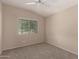 Bedroom with carpet, ceiling fan and large window with natural light at 4176 E Bonanza Rd, Gilbert, AZ 85297